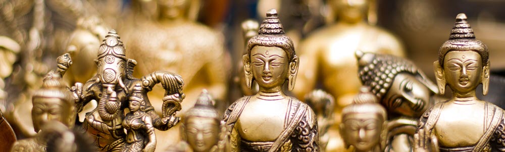 Photo of beautiful buddhas is a banner on the art of giving team page.